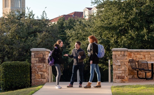 Students stopping to chat on campus